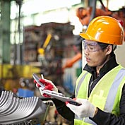 worker-in-factory-checking-quality-of-metals